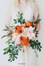 Peonies, lillies, roses, oh my! Get The Look Colorful Wedding Bouquets Colorful Wedding Bouquet Wedding Colors Fall Wedding Bouquets