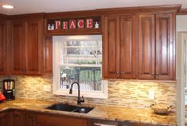 .of maple kitchen cabinets ,we have painted oak cabinets also ,after masking off the walls,counter tops floors ,and appliances and ceiling ,the cabinets will a good sanding with 220 paper and 4 coats of top coat 40 sheen ,the doors and drawers are all finished at the shop ,this kitchen was in allendale. Alder Cabinets Kc Wood