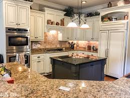 The only reason i repainted when painting glass doors, you can mask off the glass with painters tape, but i find just painting and then removing the paint that got on the glass. The Best Kitchen Cabinet Paint Colors Bella Tucker