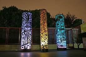 Amy Blackstone Fire Air Earth And Water Steel Cutout Columns And Illumination Outdoor Art Red Art Light Sculpture