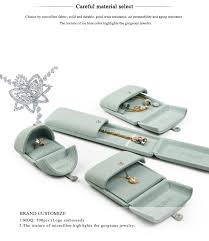 Jewelry packaging is critical for protecting necklaces, rings, bracelets, earrings, pendants and more! Fanxi Unique Custom Jewellery Gift Box For Ring Necklace Bracelet Luxury Light Green Microfiber Double Door Jewelry Packaging Box