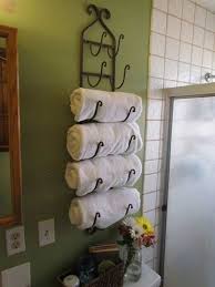 On the opposite side of the vanity, a unique hexagon shelving unit provides make your bathroom towel rack ideas serve a dual purpose. Towel Rack Ideas For Small Bathrooms Off 70