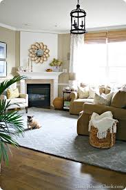 What Height Should Lights Be Hung How About Art Pieces How Big Should A Rug Be And A Living Room With Fireplace Family Room Rug Living Room Furniture Layout