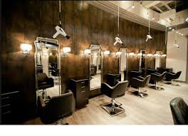 Add some large mirrors, fluorescent lighting, and red accents for a contemporary feel. Celebrity Spa Color Schemes And Lighting Salon Interior Design Hair Salon Interior Salon Interior