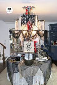 Holiday on a budget, holiday party centerpiece ideas easy pirate themed birthday party diy  crafts and ideas . Halloween Pirate Ship Table Decoration Pirate Halloween Party Halloween Party Table Pirate Theme Party