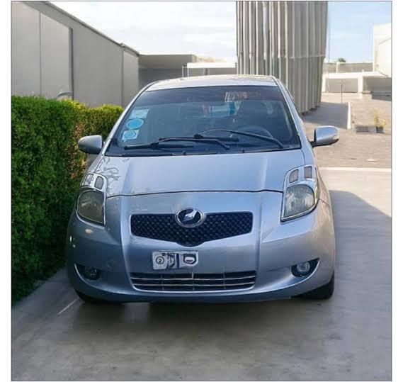 2006 Toyota Vitz in Classic Silver Metallic 1F7 available at Megebeya, AI generated