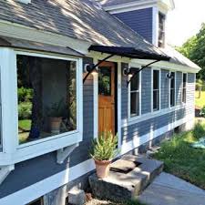 Metal awning over garage door | pleasant for you to the blog, in this particular period i will explain to you regarding metal awning over garage door. The Classic Black Metal Door Awning With The Smith Scrolls Door Awnings Metal Door Awning Awning Over Door