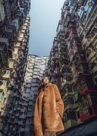 This building is probably the most instagrammed site of hong kong and a perfect illustration for dense housing in a megapolis. The Audrey A Line Coat Is A Chic Classic That Features A Shape Transformed By Stylized Scal Hong Kong Travel Hong Kong Travel Photography Hong Kong Photography