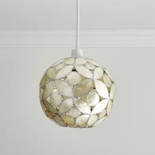 Capiz flower pendant hung from a cotton candy pink ceiling coordinating with pink walls. Wilko Silver Capiz Floral Ball Light Shade Wilko