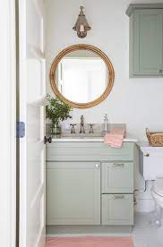 Pair a light, airy green with bamboo or natural wood in the bathroom for a neutral look that still has a pop of color. Mint Green Bath Vanity With Pink Bath Mat Cottage Bathroom