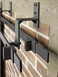 Door pulls and floor guides. Colonial Elegance Black Double Barn Door Rail System Installation Bypass Bracket At Menards
