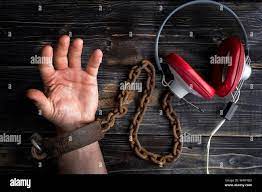 Retro headphones music addicted. Hand is handcuff Stock Photo - Alamy