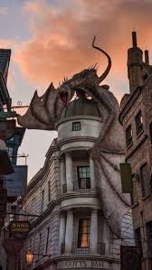 Dragon Standing On Top Of Gringotts Bank Harry Potter Phone Background Still From The Movie In 2020 Harry Potter Wallpaper Harry Potter Cool Wallpaper