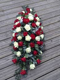 Dreamstime is the world`s largest stock photography community. Red And White Rose Casket Spray Red And White Rose Coffin Spray Funeral Flowers Funeral Floral Arrangements Funeral Flower Arrangements