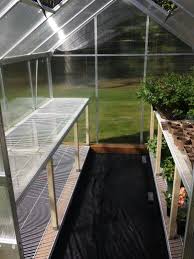 Harbor Freight 6x8 Greenhouse My Husband Made Some Great Shelving Using Closet Shelves Greenhouse Plans Greenhouse Small Greenhouse