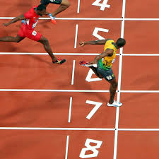 Usain bolt of jamaica crosses the finish line ahead of ryan bailey of the united states and justin gatlin of the united states to win the men's 100m final on day 9 of the london 2012 olympic games at the olympic stadium on august 5, 2012, in london, england. London 2012 Bolt Wins The 100m Final