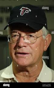 Atlanta Falcons head coach Dan Reeves wears a cap sporting the the team's  new logo during a news conference held Wednesday, March 19, 2003, in  Flowery Branch, Ga., to unveil the emblem. (