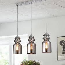Crafted from metal with a metallic finish, its frame features a circular silhouette that measures 13 in diameter. Waite 3 Light Kitchen Island Linear Pendant Pendant Lighting 3 Light Pendant Kitchen Island Lighting
