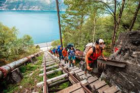 The cliff juts horizontally out from the mountain, about 700 metres (2,300 ft) above the north side of the lake ringedalsvatnet. Trolltunga Preikestolen And Kjerag Hiking Adventure 6 Days Norway Flashpackerconnect Adventure Travel