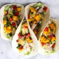 Place the fish in the oven and bake for about 10 minutes until the fish is flaky. Fish Tacos With Pineapple Mango Salsa The Culinary Compass