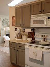 For greater harmony, most appliances, except the oven and microwave, are integrated and hidden. These Jars Just Make Me Melt Kitchen Cabinets With Black Appliances White Kitchen Appliances Outdoor Kitchen Appliances