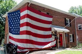 At 180 feet in height, the top of the metal flagpole towers 90 feet above an overpass junction of state route 16. Locals Hang Self Proclaimed Biggest Residential American Flag In Arlington Arlnow Com