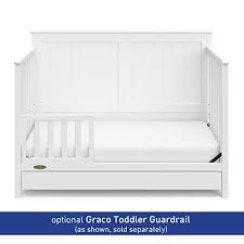 A child's arm, leg or foot description: Graco Hadley 4 In 1 Convertible Crib With Drawer White Easily Conver Gingham Ivy