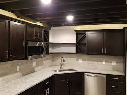 We finished the ceiling of our previous basement with sheetrock and it helped with noise tremendously. Finished Basements Canon Construction