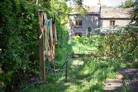What Is A Freestanding Garden Hose Hanger Pros Cons And Where To Buy Them
