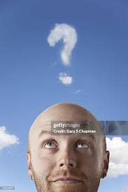 Young Bald Man Looking At Question Mark Cloud High-Res Stock Photo