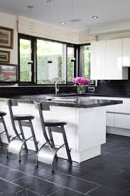 The light colored elements of the kitchen intensify the dark cabinets. 10 Best Kitchen Floor Tile Patterns Ideas Kitchen Floor Tile Kitchen Flooring Kitchen Floor Tile Patterns