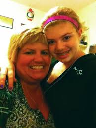 MOTHER OF THE YEAR: Judges pick Romulus woman's daughter's essay