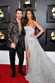 The future nostalgia singer and her man were all smiles while posing for pics as they made their way into the show holding hands at l.a.'s staples center. All The Grammys 2020 Red Carpet Dresses Grammy Awards Fashion