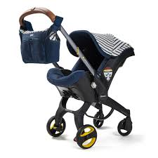 With Its Navy Striped Canvas Canopy Doona Vacation Limited Edition Captures The Spirit Of A Holiday The Iconic Desi In 2020 Baby Car Seats Stroller Car Seat Stroller