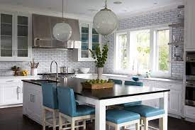 These kitchen island tables allow for more seating room, creating a casual space for dining within one of the most popular rooms in many homes. Long Kitchen Island As Dining Table With Blue Leather Stools Transitional Kitchen
