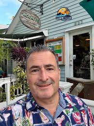 The Moondog patio is calling! 😎 Join us under the palm trees for delicious  eats and drinks, paired with island vibes, sights, & sounds! ☀️🏝️  @moondogcafekw 📷: Lydia Whitlock Barber via Facebook 💛