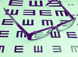 glasses and eye chart background