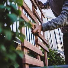Place screws at each of the four corners of the trellis as well as a couple of screws in the center to secure your trellis in place. How To Build A Planter Trellis From Stained Wood