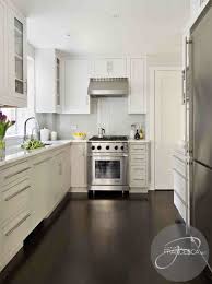 That epitomize a sophisticated and upmarket style. White Kitchen Cabinets Dark Hardwood Floors Contemporary Kitchen Interiors By Francesca
