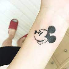 Categories, cartoon, fictional characters, disney characters, cartoon mickey tattoo disney tattoos mickey mouse tattoos movie tattoos feather tattoo design tree tattoo designs little mermaid tattoos art. Handgelenk Micky Maus Tattoo Novocom Top