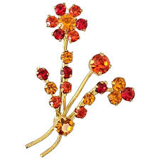 red brooch pin