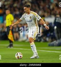 LA Galaxy midfielder Marco Delgado (8) heads the ball over Real Salt Lake  midfielder Diego Luna (26) during the second half of an MLS soccer match in  Carson, Calif., Saturday, Oct. 1,