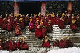 By Michael S Yamashita Xiahe China Monks Of The Yellow Hat Sect Of Tibetan Buddhism Flock Together Prior To Morning National Geographic Images Monk Tibet