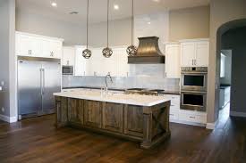 Kitchen cabinets paint or stain. Check Out This Beautiful Kitchen With A Combo Of Painted And Stained Cabinets Usin Stained Kitchen Cabinets Custom Kitchen Cabinets Kitchen Remodeling Projects
