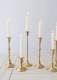 This beautiful parlor candle holder is a necessity for any antique collector who wants to add a little haunting beauty to their home. Gold Metal Candlestick Holder Centerpieces Afloral Com Gold Candle Sticks Cheap Wedding Table Centerpieces Gold Candles