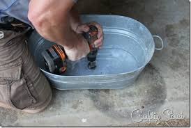 galvanized tub sink and watering can