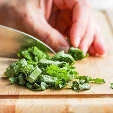 Use a sharp knife to cut the bundled basil leaves into thin slices, which will immediately drop into lovely, delicate, fragrant green ribbons. How To Cut Basil Chiffonade Method Feelgoodfoodie