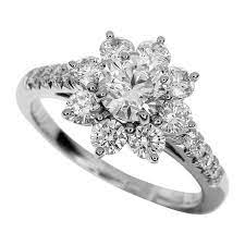 How much is the damage? Harry Winston 0 74 Carat Diamond Platinum Sunflower By Hw Small Diamond Ring For Sale At 1stdibs