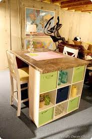 I just did something similar with a solid core door and a few cube storage shelves, but it doesn't have nearly the storage space that yours does! Diy Craft Table Craft Table Diy Craft Table Diy Kitchen Storage