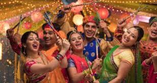 Portrait of a woman lying beside dandiya sticks. Dandiya Decoration Venuelook Blog